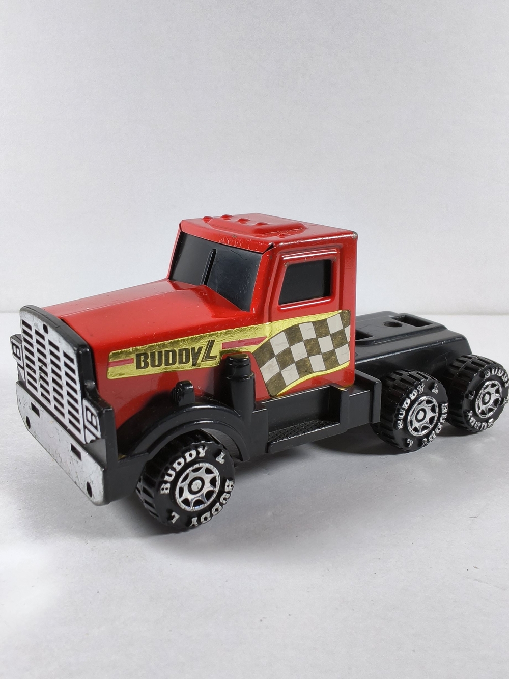 Vintage 1985 Buddy L Red Semi Truck Tractor Checkered Flag Pressed Steel 1:64